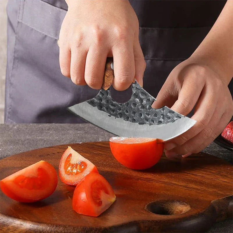 Cuchillo acero y madera cortando alimentos