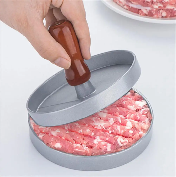 Prensa de hamburguesa aluminio en uso